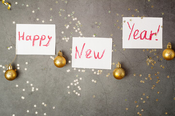 lettering happy new year and christmas tree decorations.