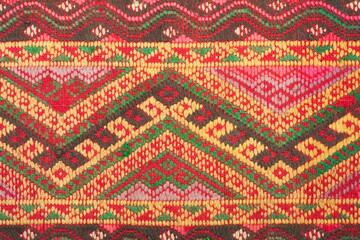 More than 100 years old colorful thai handcraft peruvian style rug surface old vintage torn conservation Made from natural materials Chemical free close up.
