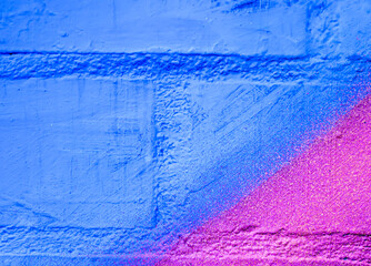 Art under ground. Beautiful street art graffiti background. The brick wall is decorated with abstract drawings house paint. Modern style urban culture of street youth. Abstract picture on wall