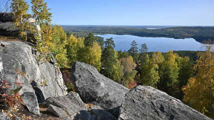 mountain landscape with autumn trees and blue sky