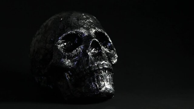 Silver skull on black background