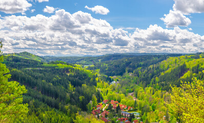 Slavkov Forest aerial panoramic view with small village, mountains, green hills and trees near...