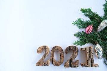 On a white background, the numbers 2021 and a Christmas tree branch. space for text, advertising...