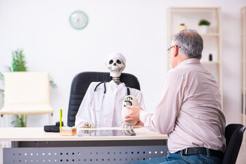 Old man giving money to dead doctor