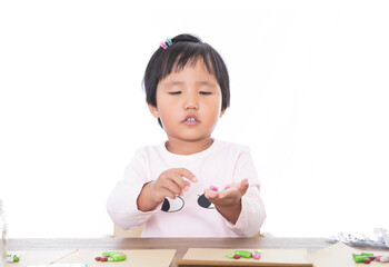 The young Chinese girl plays the role of the doctor to distribute medicine