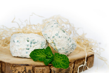 Collection of French cheeses, a piece of soft blue Le Bleu cheese made from cow's milk with white mold close-up
