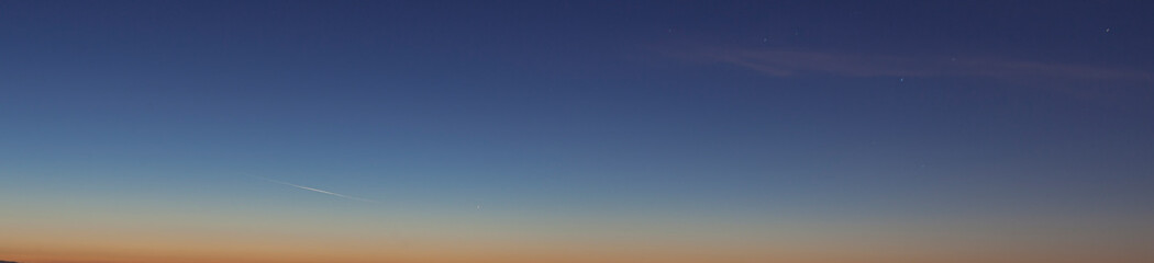 Dramatic colorful sky with afterglow and illuminated clouds
