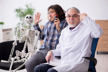 Young male patient visiting experienced doctor psychiatrist