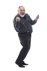 Naklejka premium side view. happy elderly man with a smartphone