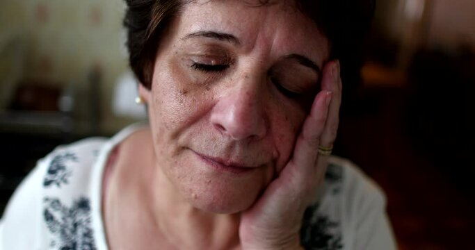 Depressed older woman feeling sad, Sad senior 60 year old lady suffering