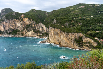 Corfu Greece tropical paradise island Ampelaki Bay mountain cliff and ocean in Paleokastritsa