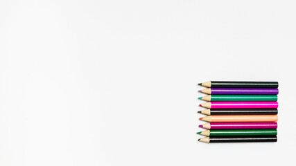 School colorful pencils on white background with copy space