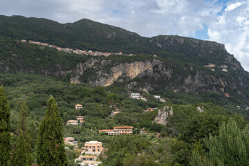Fototapeta premium Corfu Greece tropical island paradise village on mountain side hill surreal landscape