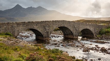 Fototapeta premium Crossing the river Sligachan at Sligachan is the old three arched bridge