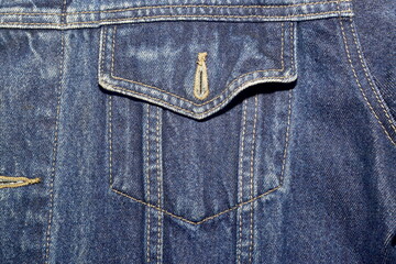 Front pocket of denim jacket classic design closeup