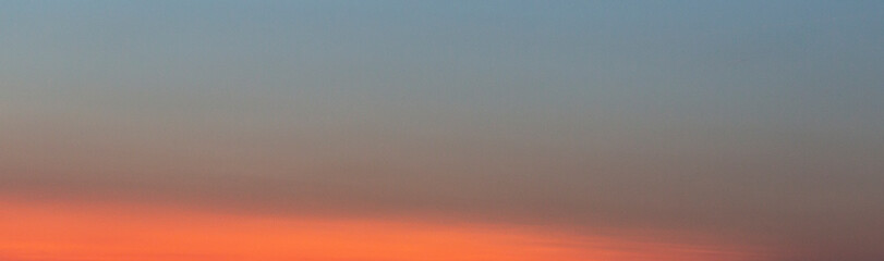 Dramatic colorful sky with afterglow and illuminated clouds