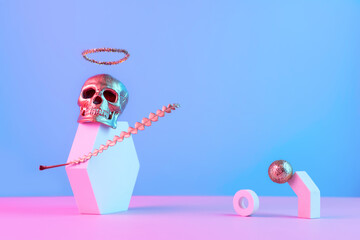 Golden skull with halo and geometric shapes on a pink blue background, Halloween concept.