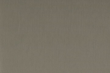 Woolen gray fabric. Natural grey fabric background. Simple, plain fabric.