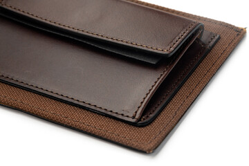 Brown shiny wallet isolated on white background