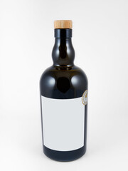 dark whiskey bottle with wooden stopper