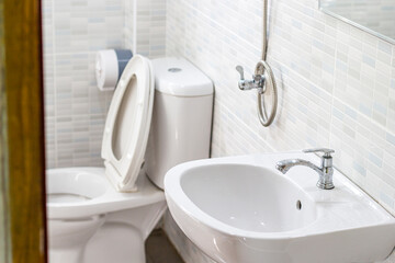 Tap on white basin in the bathroom modern style
