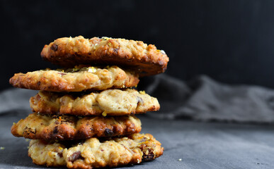 Oatmeal cookies. Homemade baking. cookies with dried apricots and chocolate. Copy space. Isolated on Dark background.