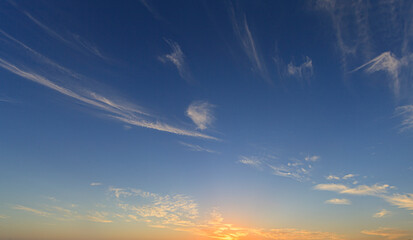 Dramatic colorful sky with afterglow and illuminated clouds