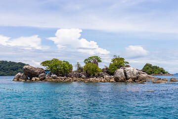 Naklejka premium A small island in the middle of the sea for snorkeling at Koh Chang, Thailand.