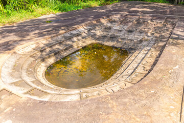 Huge Buddha footprints in the mountains in the deep forest of Nakhon Ratchasima, Thailand.