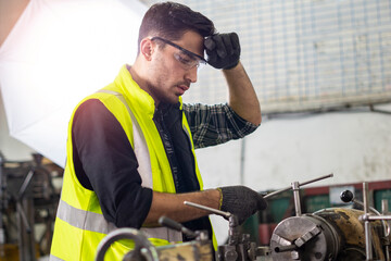 Industrial Engineer working for machine maintenance at the factory.