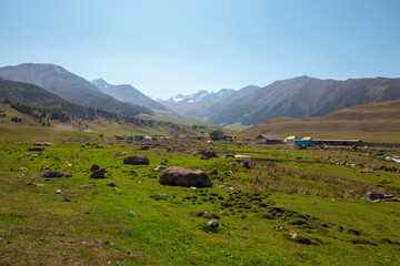Obraz premium Mountain landscape. A hot summer day, red clay and burnt grass. Kyrgyzstan.