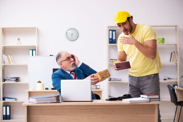 Young male courier delivering pizza to the office