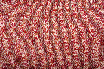 Colored red and white knitted texture abstract background