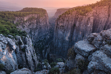 Fototapeta na wymiar Grandiose fascinating and deep Tazi canyon in Turkey at sunrise. A famous tourist attraction and a great place for photos and Hiking in the mountains. Koprulu nature Park