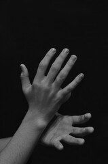 men's hands on a dark background close-up