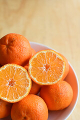 Fresh Colourful Oranges in the Plate
