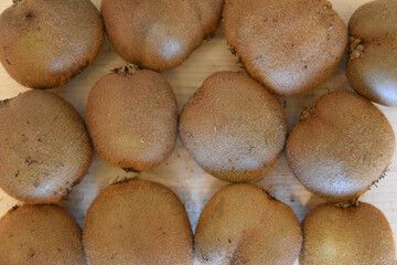 Fresh Kiwis on Wooden Table