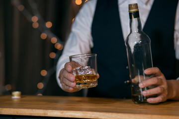 Barman pouring whiskey whiskey glass beautiful night