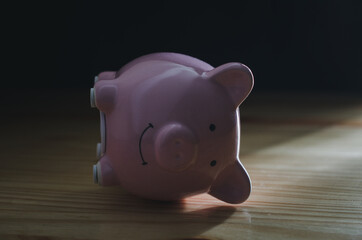 Fototapeta premium Piggy Bank on wood table.money saving financial concept.