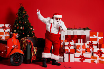 Full length photo of crazy santa claus sing song in mic isolated on red bright color background...