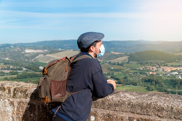 A man on his back looking at a panoramic view