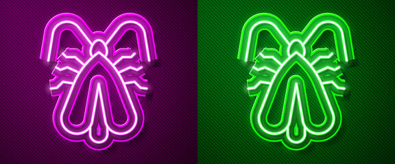 Glowing neon line Clothes moth icon isolated on purple and green background. Vector.