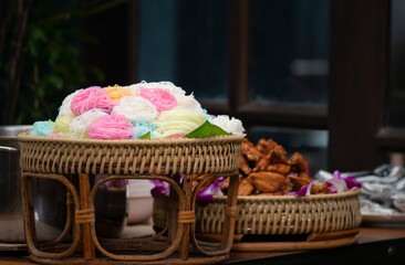 Colorful of Thai vermicelli eaten in basket. Rice noodle colorful or rice vermicelli noodle. Thai style food delicious and beautiful food. 
