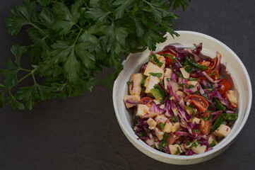fresh vegetable salad in a white plate on the table