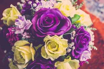 Fototapeta na wymiar valentine day background, wedding bouquet roses flower close up in retro filter