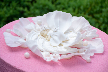 sculpture of an angel on a white flower. cake decoration