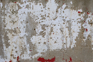 The texture of old concrete with traces of white paint. Background for design