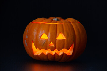 scary Halloween pumpkin in a black background