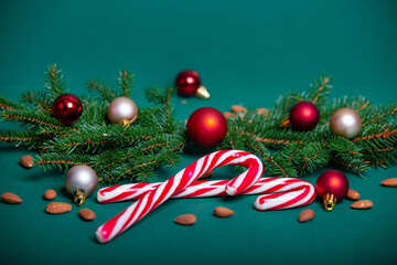 Christmas background. Spruce branches, Christmas toys, sweets.