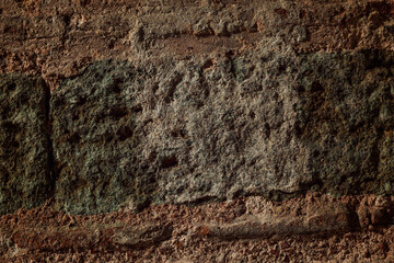Old brown destroyed stone wall. Background. Space for text.